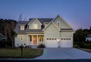 Front elevation of beautiful home lit up at twilight perfect for home inspection belmont nc